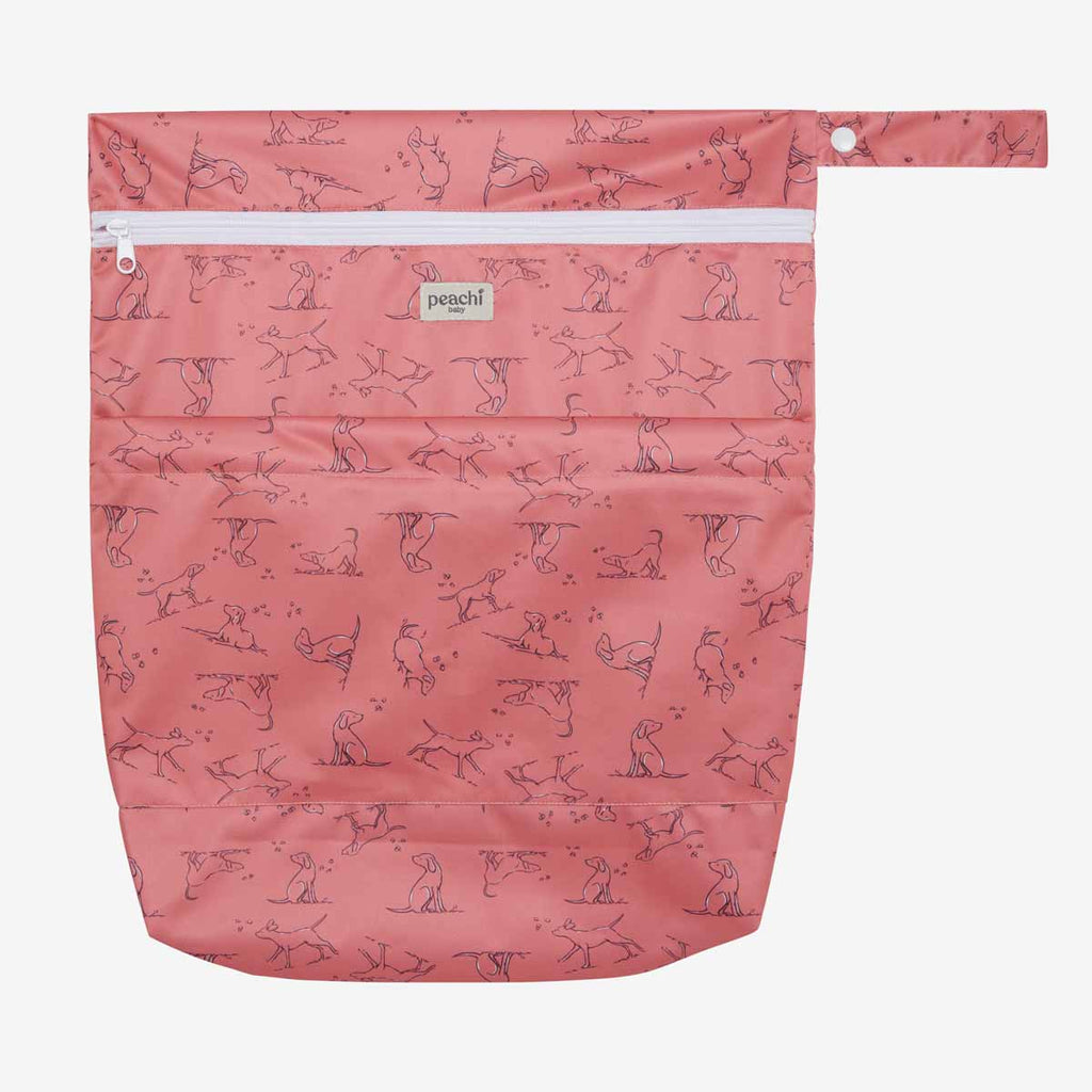 wetbag for baby's dirty items in a red dogs print