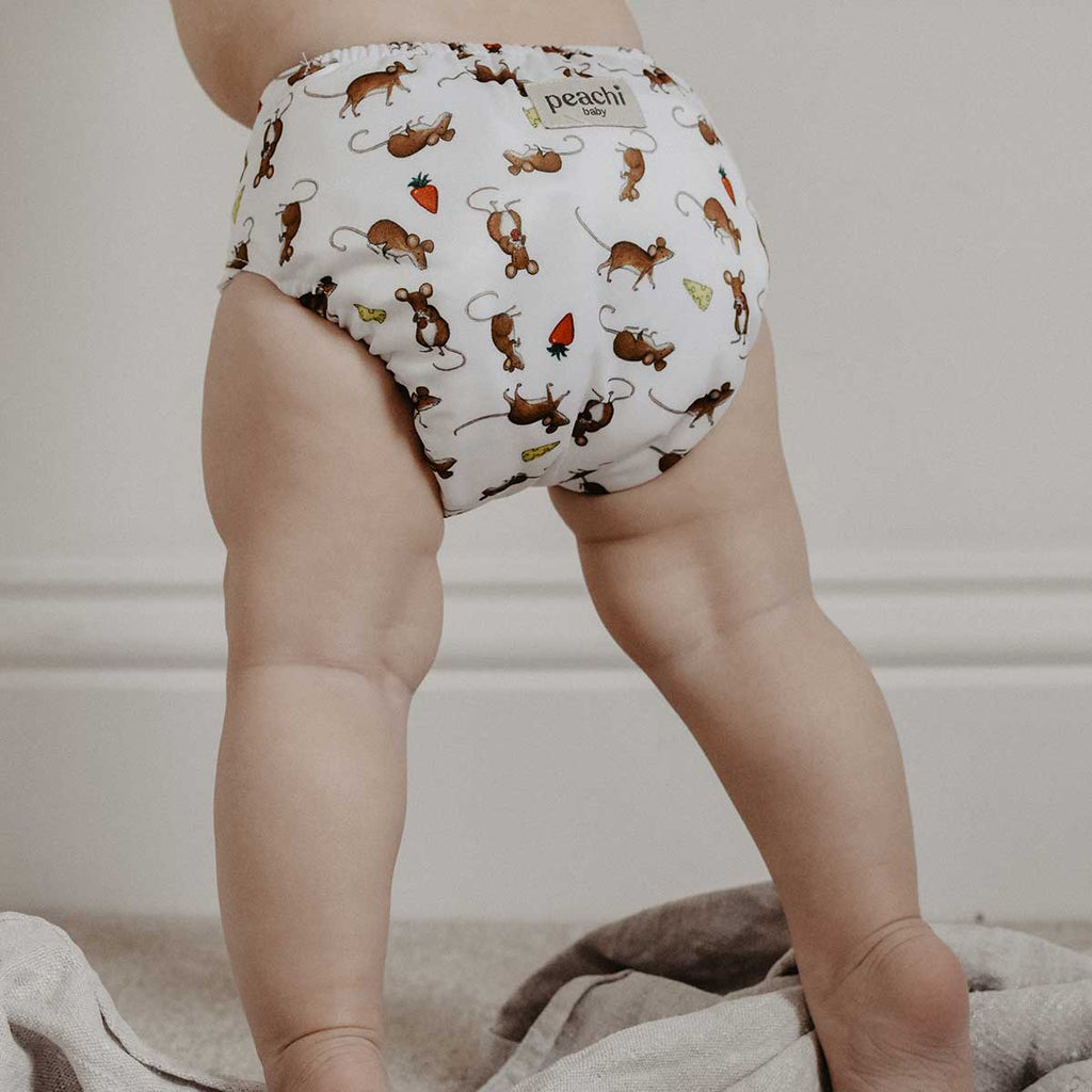 toddler wearing a mouse print modern cloth nappy by peachi baby