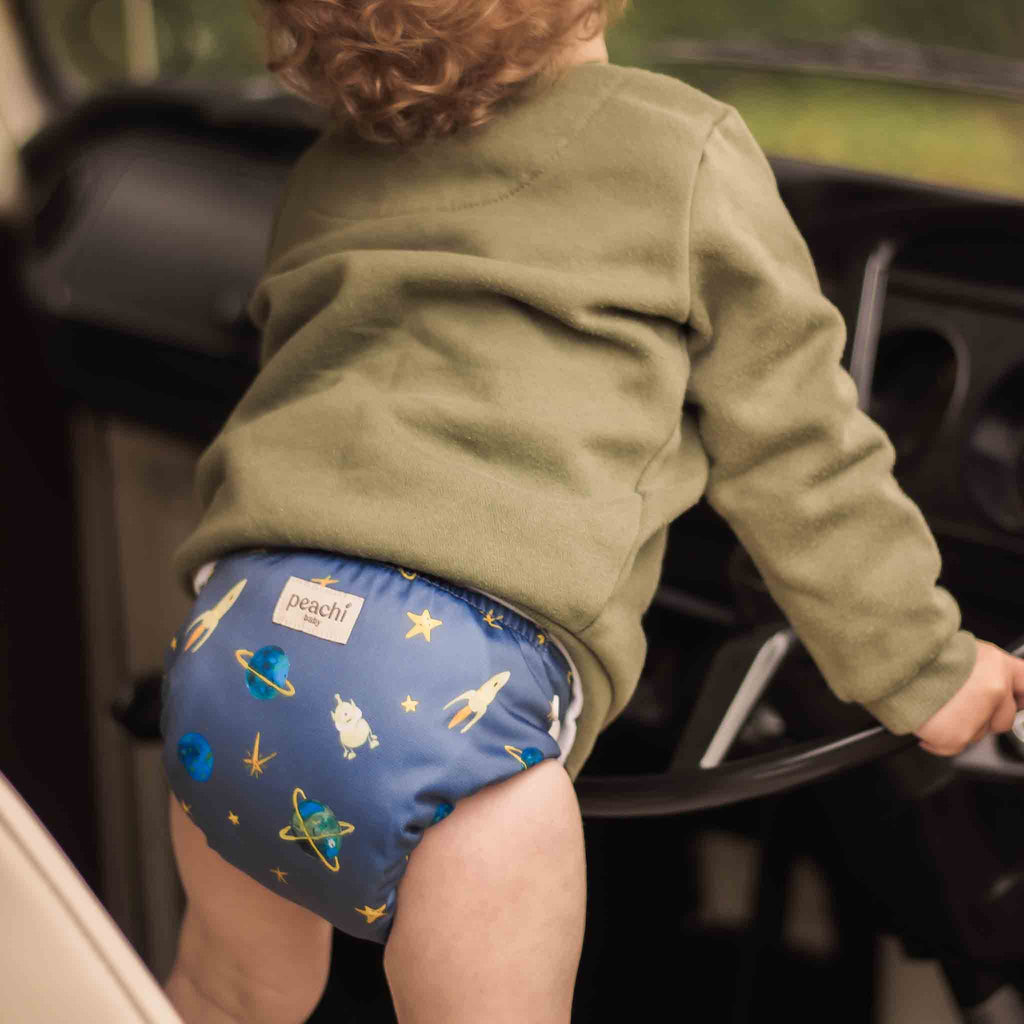 toddler wearing a space reusable nappy