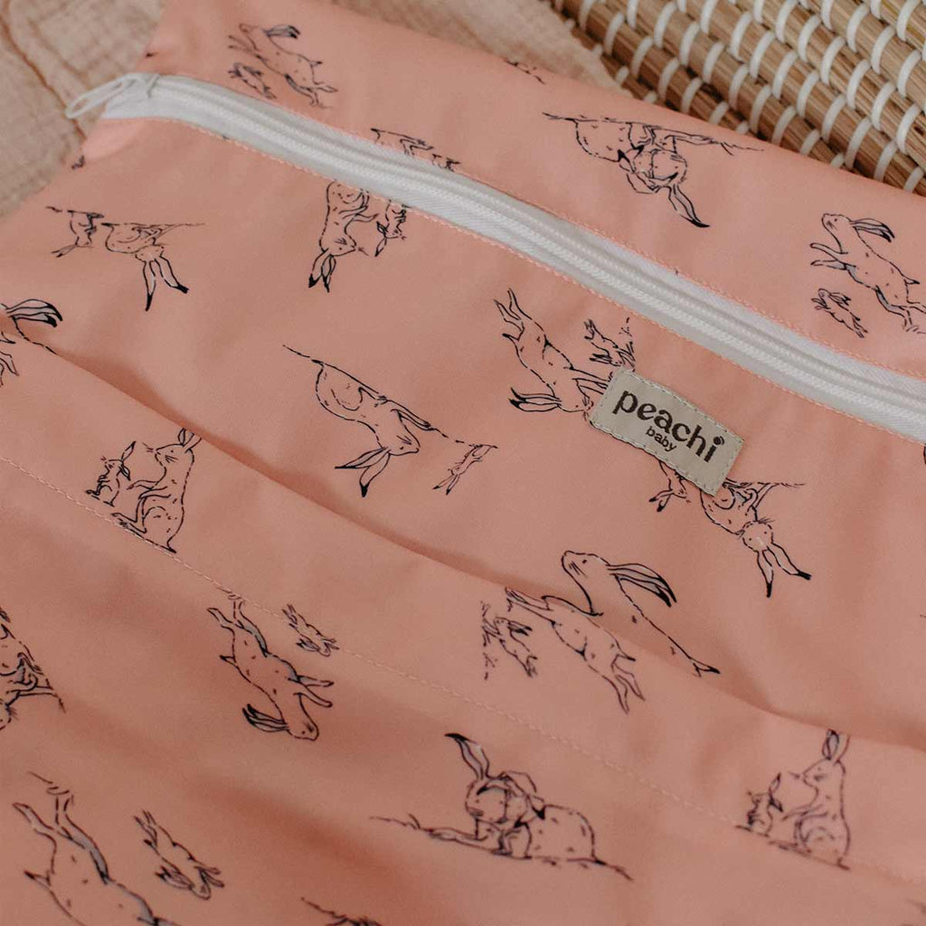 hares print nappy wetbag in a peach print
