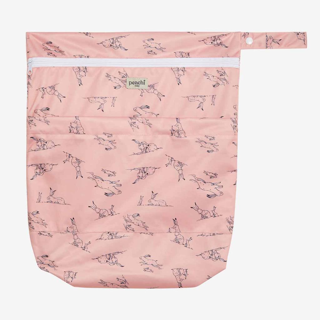 peach coloured hares print nappy wetbag by peachi baby