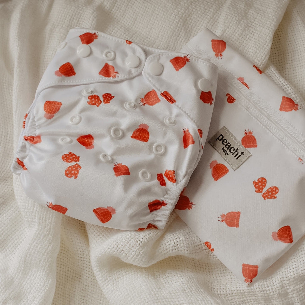 Mittens print modern cloth nappy by Peachi Baby and matching wet bag