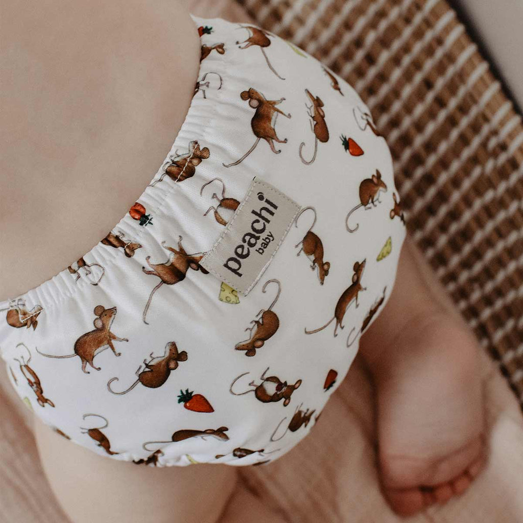 baby wearing a mouse print modern cloth nappy by peachi baby