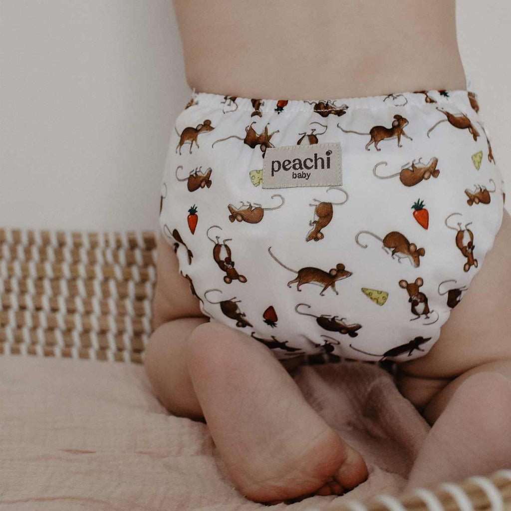 baby wearing a mouse print reusable nappy by peachi baby