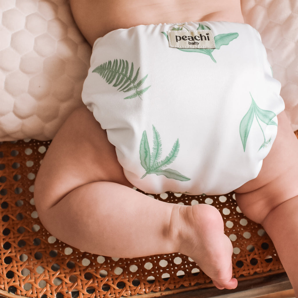 Toddler wearing a Reusable Nappy Paradise Fern Reusable Nappy Set by Peachi Baby