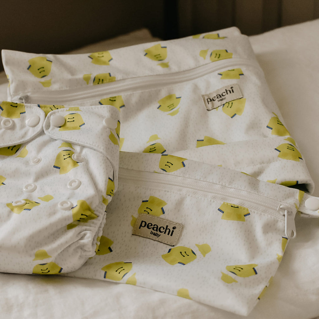 yellow raincoat print wetbag for baby's dirty items